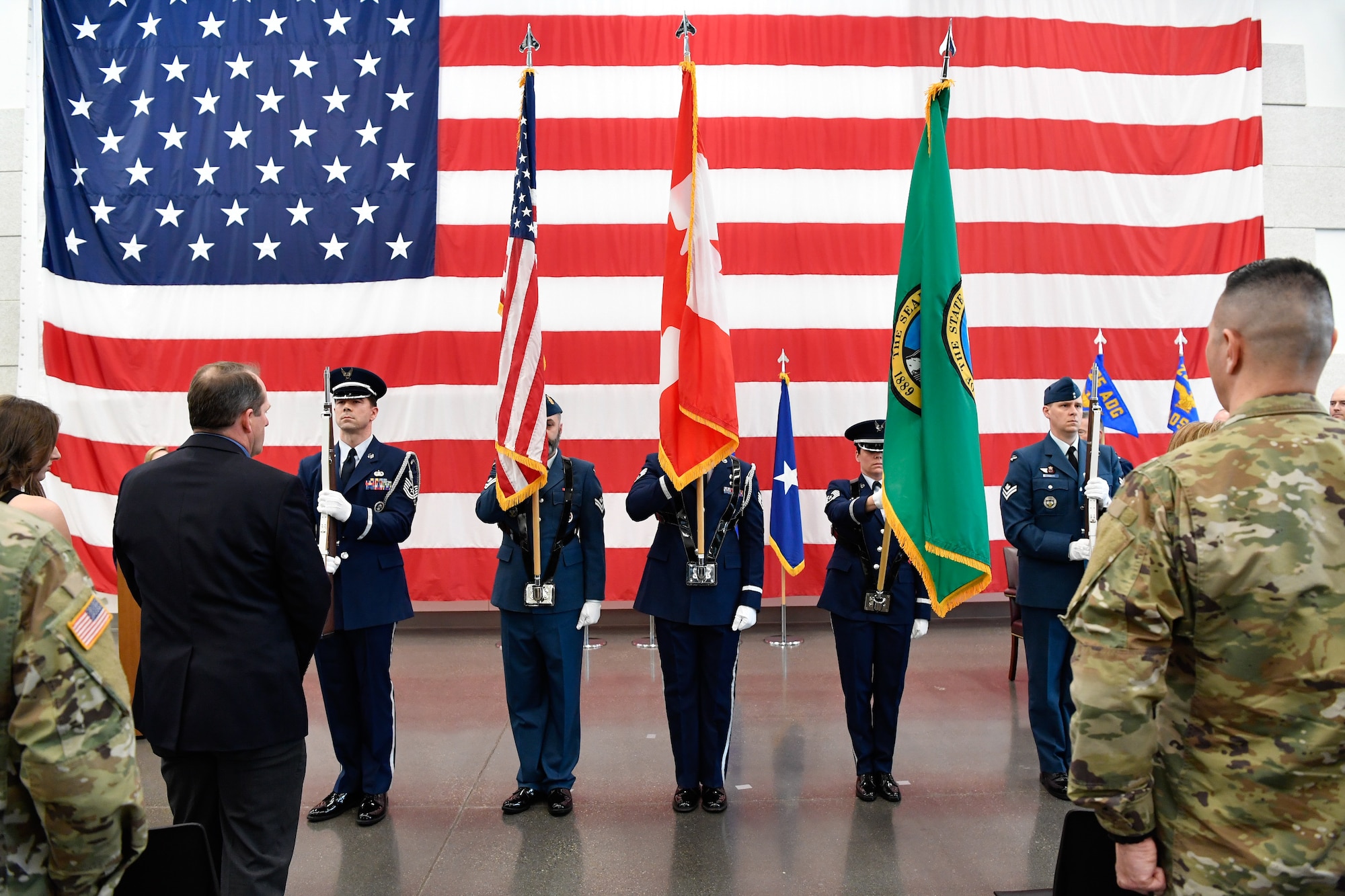 Members of the Western Air Defense Sector Honor Guard post the colors during the 225th Air Defense Group assumption of command ceremony at the Pierce County Readiness Center, Camp Murray, Washington, April 10, 2019. (U.S. Air National Guard photo by Capt. Colette Muller)