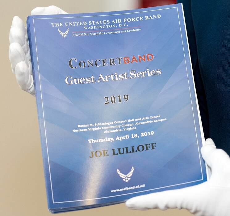 A member of the U.S. Air Force Honor Guard holds programs for the final concert of The U.S. Air Force Band's 2019 Guest Artist Series. The concert featured internationally acclaimed saxophonist Joe Lulloff. (U.S. Air Force photo by Master Sgt. Grant Langford)