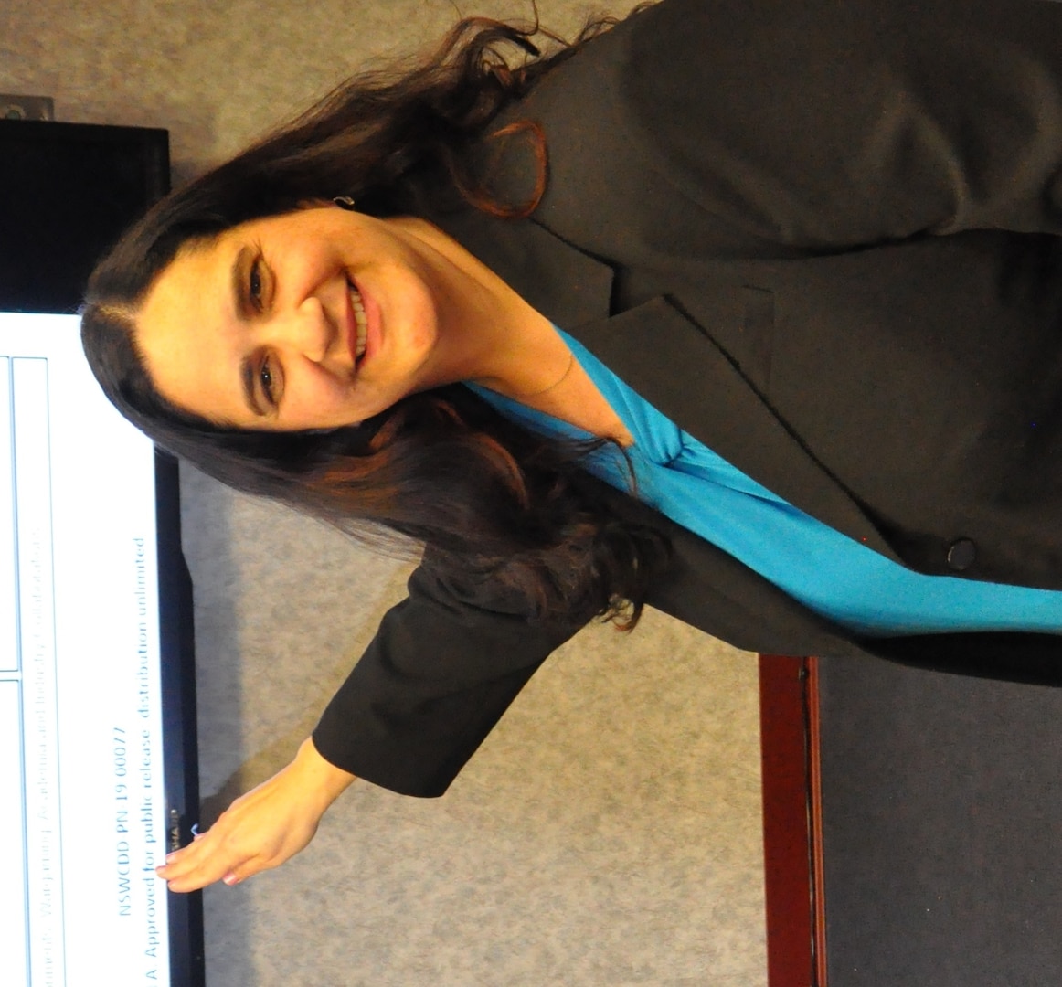IMAGE: DAHLGREN, Va. (March 28, 2019) – Dr. Elizabet Haro – a Naval Surface Warfare Center Dahlgren Division (NSWCDD) engineer who specializes in Human Systems Integration (HSI) – credits her parents’ inspiration and dedication for motivating her to be the first in her family to graduate from college. Haro’s motivation eventually led to a doctoral degree and her current position leading a science and technology team focused on developing a strategic direction of applied research and advanced technology development to grow the Navy’s expertise in Human Performance, Human-Device Interaction and HSI.

“I came to this country when I was eight years old. Only my immediate family accompanied me on the journey and I remember vividly leaving my friends behind because freedom no longer existed,” recounted Haro. “My journey to freedom was through the sea. My parents came to this country without knowing anyone or speaking the language. But they knew that through hard work, education and dedication, the opportunities were endless for my sisters and me. After finishing my bachelor’s and master’s degrees at Purdue University, I knew I wasn’t done.  It took me years, but I finally went back to school and finished my PhD at Virginia Tech. I joined NSWC Dahlgren Division because I want to help protect the freedom and waters that gave me the opportunities and embraced my family, when I was a child.”