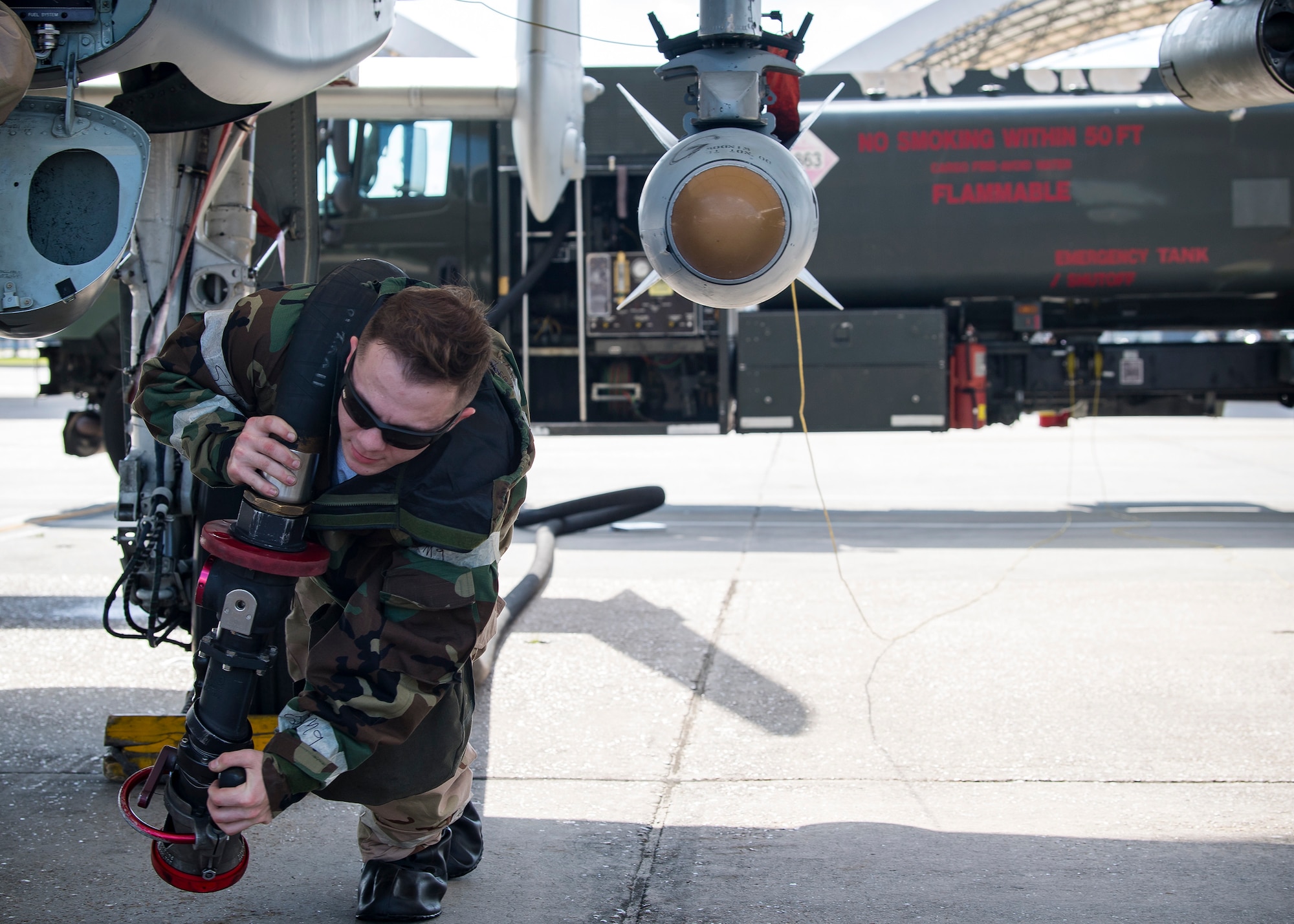 An Airman from the 75th Aircraft Maintenance unit carries a gas hose during exercise FT 19-04, April 18, 2019, at Moody Air Force Base, Ga. The exercise focused on high operations tempo and the ability to survive and operate in a chemical, biological, radioactive and nuclear environment to meet Chief of
Staff of the Air Force and the Commander of Air Combat Command’s intent for readiness. (U.S. Air Force photo by Airman 1st Class Eugene Oliver)