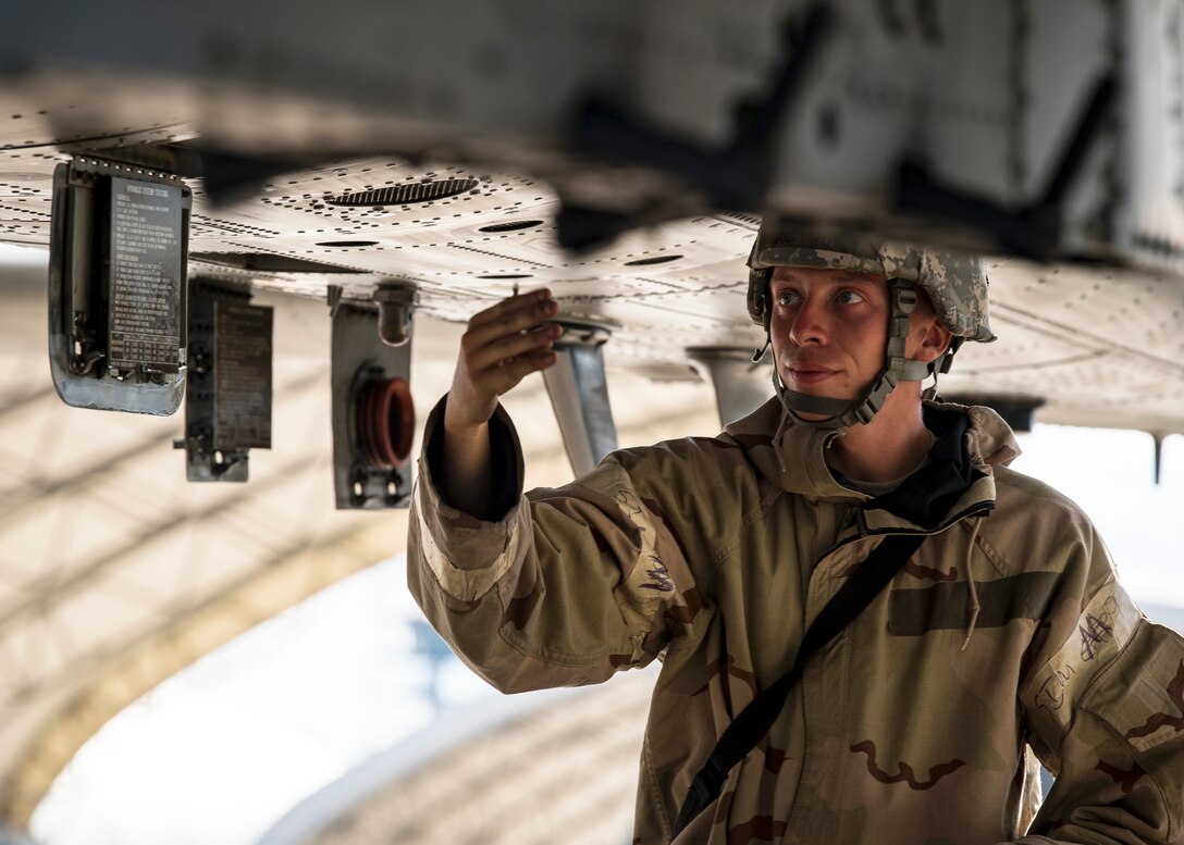 Airman 1st Class John Glass, 75th Aircraft Maintenance Unit crew chief, inspects the external panels of an A-10C Thunderbolt II during exercise FT 19-04, April 18, 2019, at Moody Air Force Base, Ga. The exercise focused on high operations tempo and the ability to survive and operate in a chemical, biological, radioactive and nuclear environment to meet Chief of Staff of the Air Force and the Commander of Air Combat Command’s intent for readiness. (U.S. Air Force photo by Airman 1st Class Eugene Oliver)