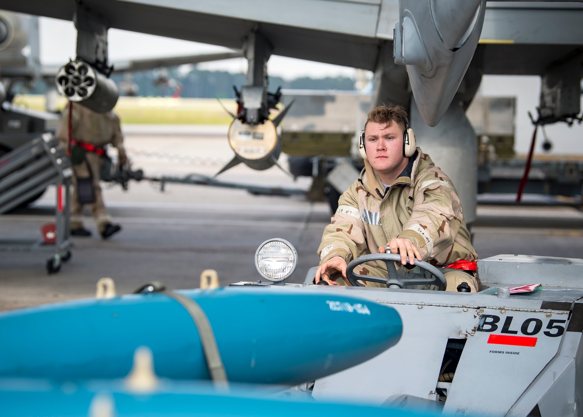 An Airman from the 23d Maintenance Group transports ammunitions during FT 19-04, April 18, 2019, at Moody Air Force Base, Ga. The exercise focused on high operations tempo and the ability to survive and operate in a chemical, biological, radioactive and nuclear environment to meet Chief of
Staff of the Air Force and the Commander of Air Combat Command’s intent for readiness. (U.S. Air Force photo by Airman 1st Class Eugene Oliver)