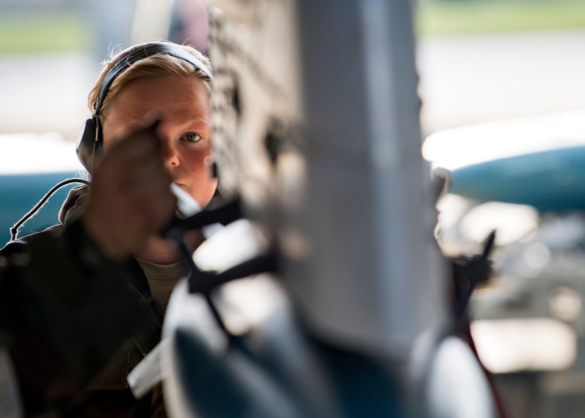 Senior Airman Brianna Stone, 476th Maintenance Squadron weapons load crew member, inspects the alignment of an ammunition during FT 19-04, April 18, 2019, at Moody Air Force Base, Ga. The exercise focused on high operations tempo and the ability to survive and operate in a chemical, biological, radioactive and nuclear environment to meet Chief of Staff of the Air Force and the Commander of Air Combat Command’s intent for readiness. (U.S. Air Force photo by Airman 1st Class Eugene Oliver)