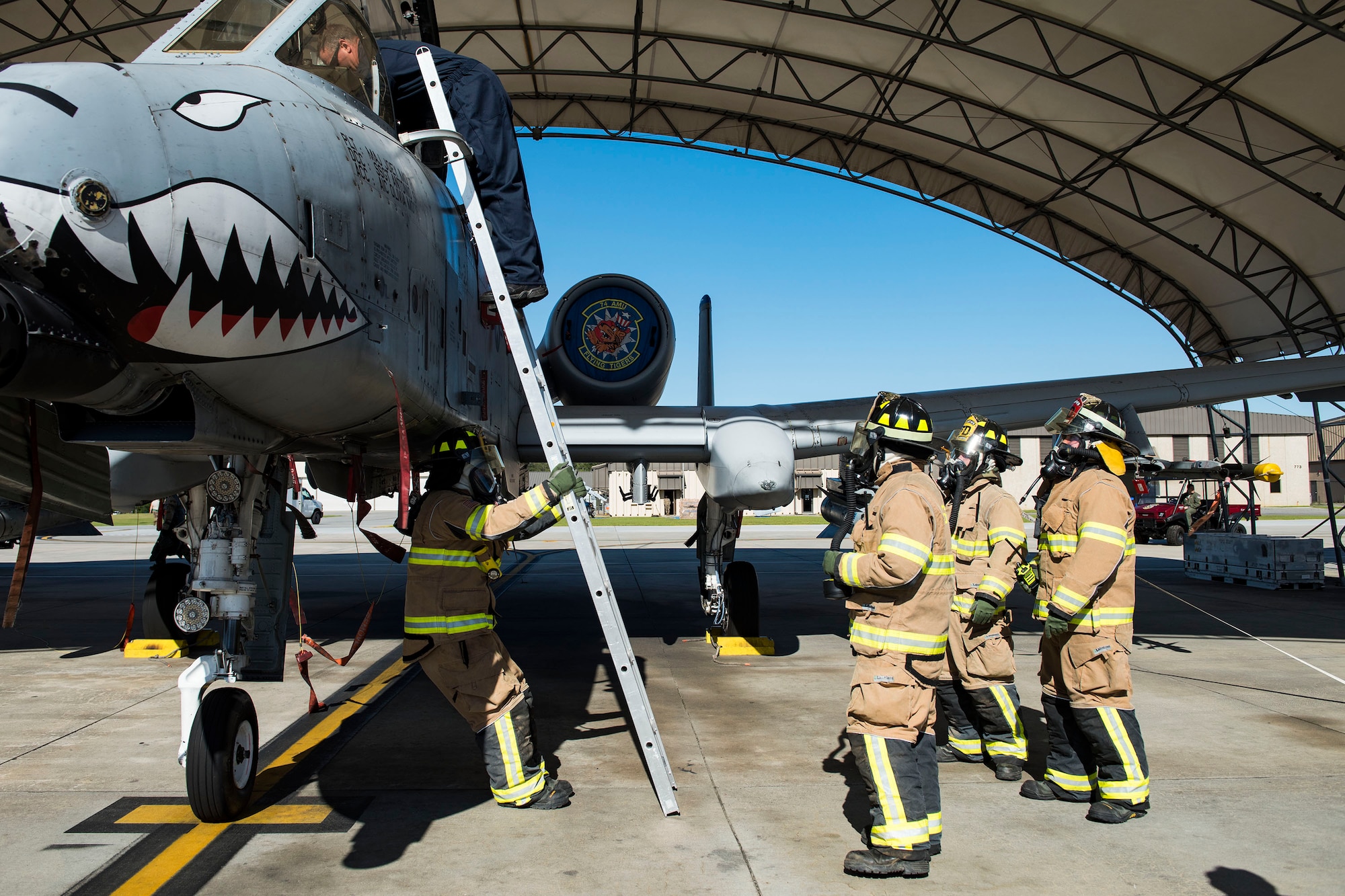 Airmen from the 23d Civil Engineer Squadron perform final inspections during an A-10 Thunderbolt II fire egress and pilot extrication during exercise FT 19-04, April 16, 2019, at Moody Air Force Base, Ga. The exercise focused on high-operations tempo and the ability to survive and operate in a chemical, biological, radioactive and nuclear environment to meet Chief of Staff of the Air Force and the Commander of Air Combat Command’s intent for readiness. (U.S. Air Force photo by Senior Airman Erick Requadt)