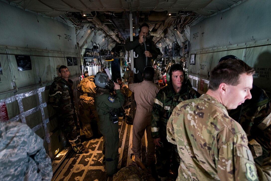 Airmen from the 347th Rescue Group prepare for a medical evacuation while enroute to Maxwell Air Force Base, Ala. for in-flight patient care training during exercise FT 19-04, April 18, 2019. The training involved performing a medical evacuation and recovering simulated-wounded personnel from Maxwell, followed by doing in-flight patient care for multiple categories of wounds. The exercise focused on high operations tempo and the ability to survive and operate in a chemical, biological, radioactive and nuclear environment to meet Chief of Staff of the Air Force and the Commander of Air Combat Command’s intent for readiness. (U.S. Air Force photo by Senior Airman Erick Requadt)