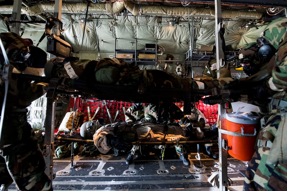 Airmen from the 347th Rescue Group position simulated-wounded personnel during in-flight patient care training during exercise FT 19-04, April 18, 2019, at Maxwell Air Force Base, Ala. The training involved performing a medical evacuation and recovering simulated-wounded personnel from Maxwell, followed by doing in-flight patient care for multiple categories of wounds. The exercise focused on high operations tempo and the ability to survive and operate in a chemical, biological, radioactive and nuclear environment to meet Chief of Staff of the Air Force and the Commander of Air Combat Command’s intent for readiness. (U.S. Air Force photo by Senior Airman Erick Requadt)