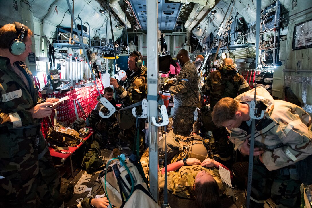 Airmen in the 347th Rescue Group perform in-flight patient care training during exercise FT 19-04, April 18, 2019. The training involved performing a medical evacuation and recovering simulated-wounded personnel from Maxwell Air Force Base, Ala., followed by doing in-flight patient care for multiple categories of wounds. The exercise focused on high operations tempo and the ability to survive and operate in a chemical, biological, radioactive and nuclear environment to meet Chief of Staff of the Air Force and the Commander of Air Combat Command’s intent for readiness. (U.S. Air Force photo by Senior Airman Erick Requadt)