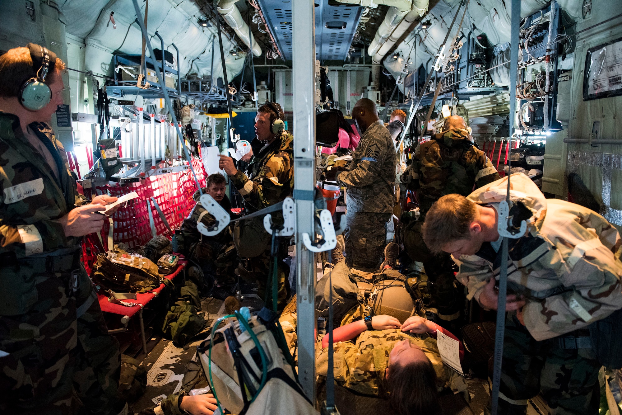 Airmen in the 347th Rescue Group perform in-flight patient care training during exercise FT 19-04, April 18, 2019. The training involved performing a medical evacuation and recovering simulated-wounded personnel from Maxwell Air Force Base, Ala., followed by doing in-flight patient care for multiple categories of wounds. The exercise focused on high operations tempo and the ability to survive and operate in a chemical, biological, radioactive and nuclear environment to meet Chief of Staff of the Air Force and the Commander of Air Combat Command’s intent for readiness. (U.S. Air Force photo by Senior Airman Erick Requadt)