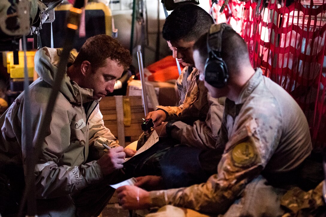 An Airman in the 41st Rescue Squadron annotates medical treatment given during in-flight patient care training during exercise FT 19-04, April 18, 2019. The training involved performing a medical evacuation and recovering simulated-wounded personnel from Maxwell Air Force Base, Ala., followed by doing in-flight patient care for multiple categories of wounds. The exercise focused on high operations tempo and the ability to survive and operate in a chemical, biological, radioactive and nuclear environment to meet Chief of Staff of the Air Force and the Commander of Air Combat Command’s intent for readiness. (U.S. Air Force photo by Senior Airman Erick Requadt)