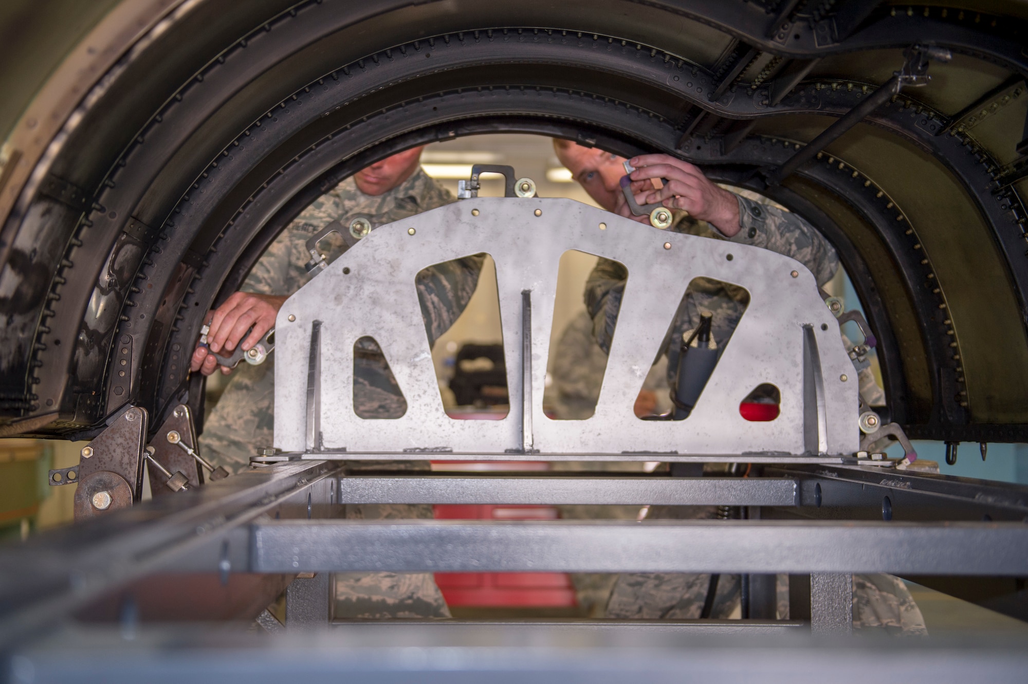 U.S. Air Force Airman 1st Class Joseph Pierce and Staff Sgt. Quinn Smith, sheet metal technicians with the 116th Air Control Wing aircraft structural maintenance section, Georgia Air National Guard, secure a Joint STARS cowling the newly-created cowling fixture table April 3, 2019, at Robins AFB, Ga.