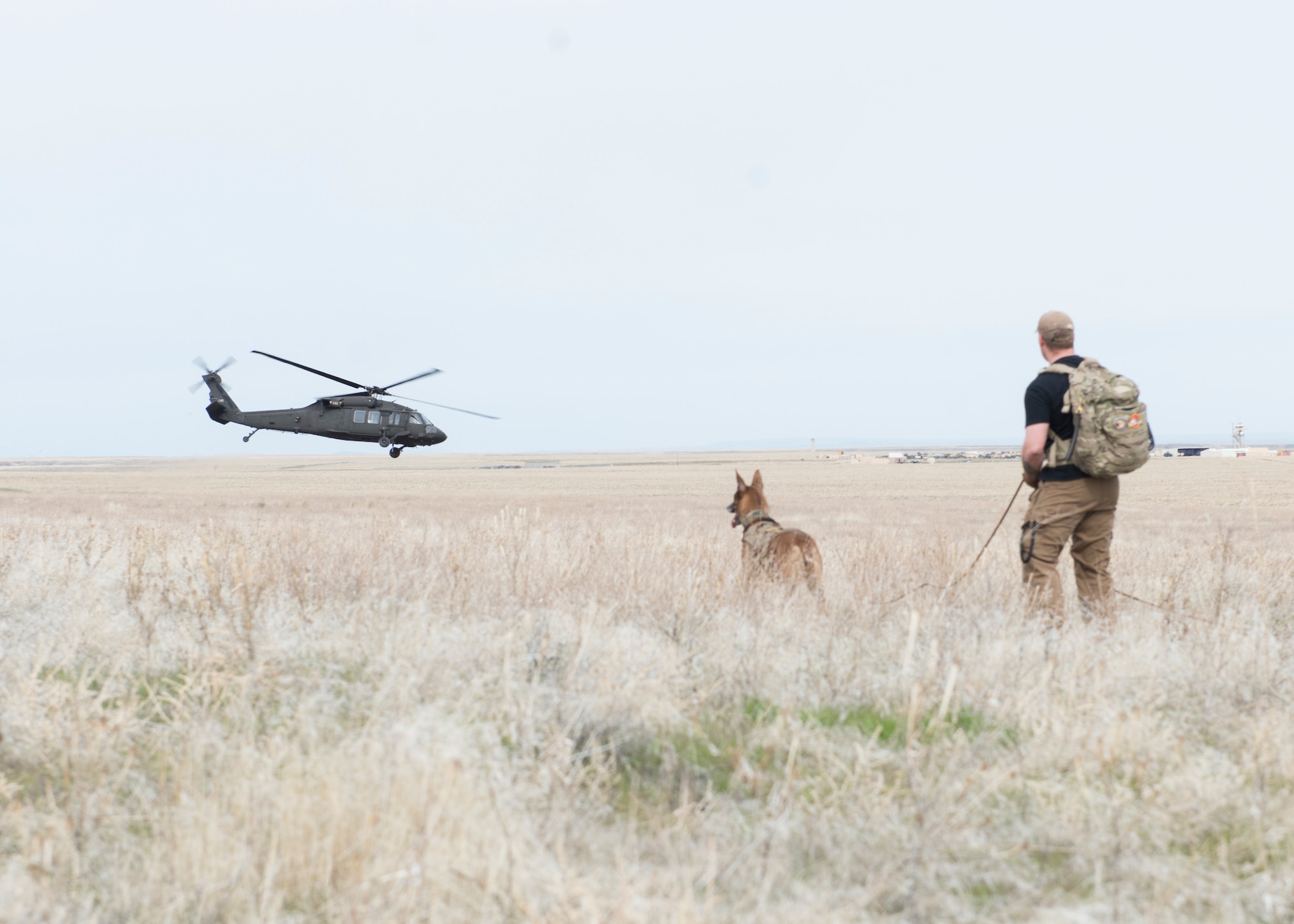 A helicopter retrieves aircrew from sailor creek range for Combat Survival Training during Gunfighter Flag, March 2, 2019. Aircrew from Mountain Home Air Force base underwent refresher training on evading capture and acquiring recovery from Combat Search and Rescue Personnel during Gunfighter Flag as the 366th Security Forces used their K9s to search for them. (U.S. Air Force photo by Senior Airman Tyrell Hall)