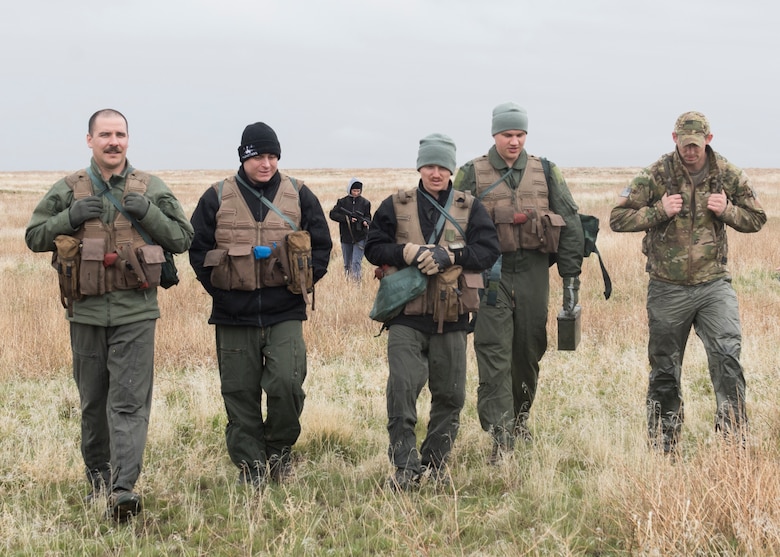 Staff Sergeant David H Chorpenning, 366th OSKP, walks with a team he organized for a combat survival training after an exercise for Gunfighter Flag, March 2, 2019. Air crew from Mountain Home Air Force base underwent refresher training on evading capture and acquiring recovery from Combat Search and Rescue Personnel during Gunfighter Flag. (U.S. Air Force photo by Senior Airman Tyrell Hall)