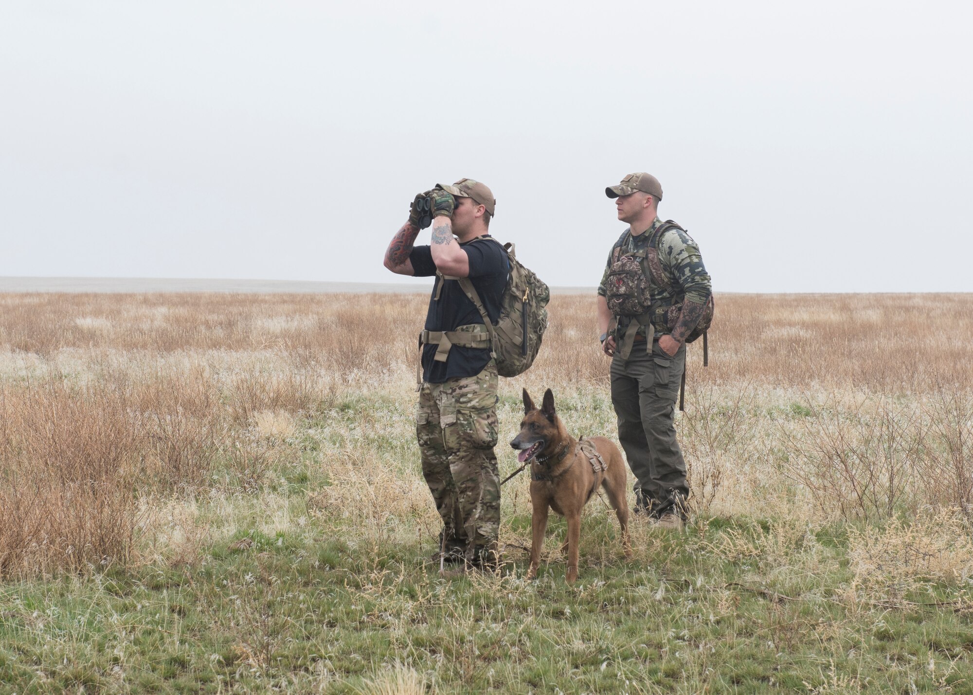 Senior Airman Wade D. Alfson searches for air crew in a simulated search during a training exercise for Gunfighter Flag, March 2, 2019 at sailor creek range. Air crew from Mountain Home Air Force base underwent refresher training on evading capture and acquiring recovery from Combat Search and Rescue Personnel during Gunfighter Flag. (U.S. Air Force photo by Senior Airman Tyrell Hall)