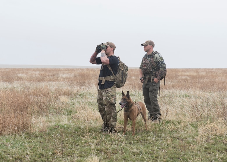 Senior Airman Wade D. Alfson searches for air crew in a simulated search during a training exercise for Gunfighter Flag, March 2, 2019 at sailor creek range. Air crew from Mountain Home Air Force base underwent refresher training on evading capture and acquiring recovery from Combat Search and Rescue Personnel during Gunfighter Flag. (U.S. Air Force photo by Senior Airman Tyrell Hall)