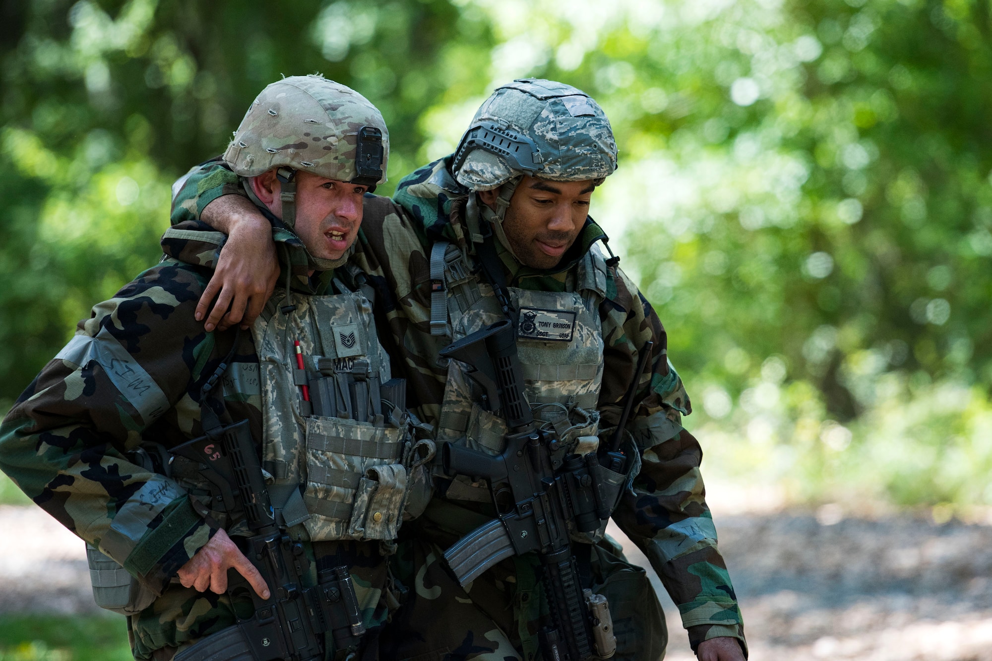 U.S. Air Force Tech. Sgt. Nathaniel Mace, 23rd Security Forces Squadron flight chief, left, assists wounded personnel to a Humvee after responding to a simulated ground attack during exercise FT 19-04 at Moody Air Force Base, Georgia, April 17, 2019. The 23rd SFS responded to a surface-to-air site through a ground attack and ambush, resulting in the Airmen providing self-aid buddy care and escorting wounded personnel to a medical facility. The exercise focused on high operations tempo and the ability to survive and operate in a chemical, biological, radioactive and nuclear environment to meet chief of Staff of the Air Force and the commander of Air Combat Command’s intent for readiness. (U.S. Air Force photo by Senior Airman Erick Requadt)