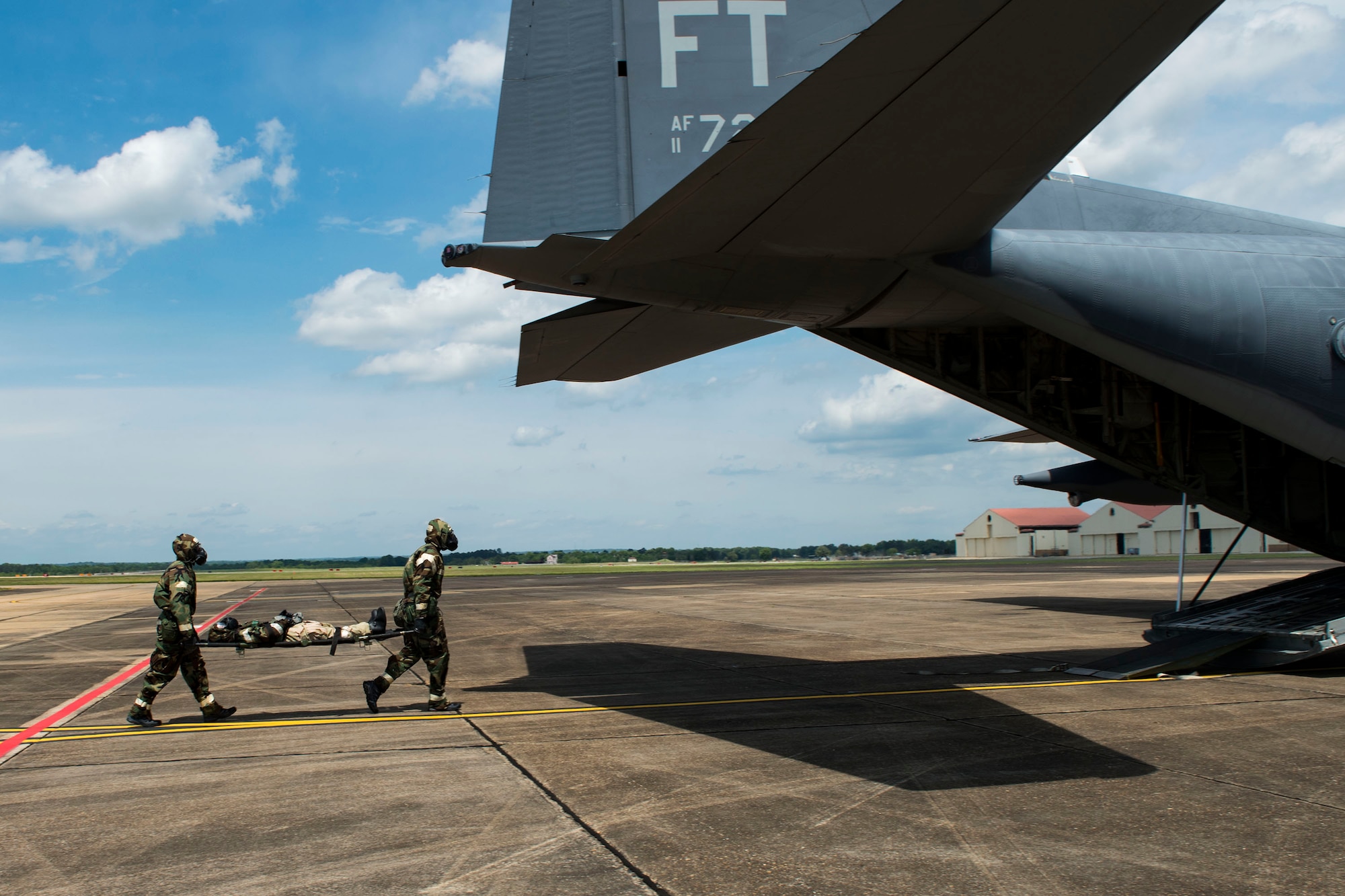 Airmen from the 347th Rescue Group carry a simulated-wounded personnel during in-flight patient care training during exercise FT 19-04 at Maxwell Air Force Base, Alabama, April 18, 2019. The training involved performing a medical evacuation and recovering simulated-wounded personnel from Maxwell AFB, followed by in-flight patient care for multiple categories of wounds. The exercise focused on high operations tempo and the ability to survive and operate in a chemical, biological, radioactive and nuclear environment to meet Chief of Staff of the Air Force and the Commander of Air Combat Command’s intent for readiness. (U.S. Air Force photo by Senior Airman Erick Requadt)