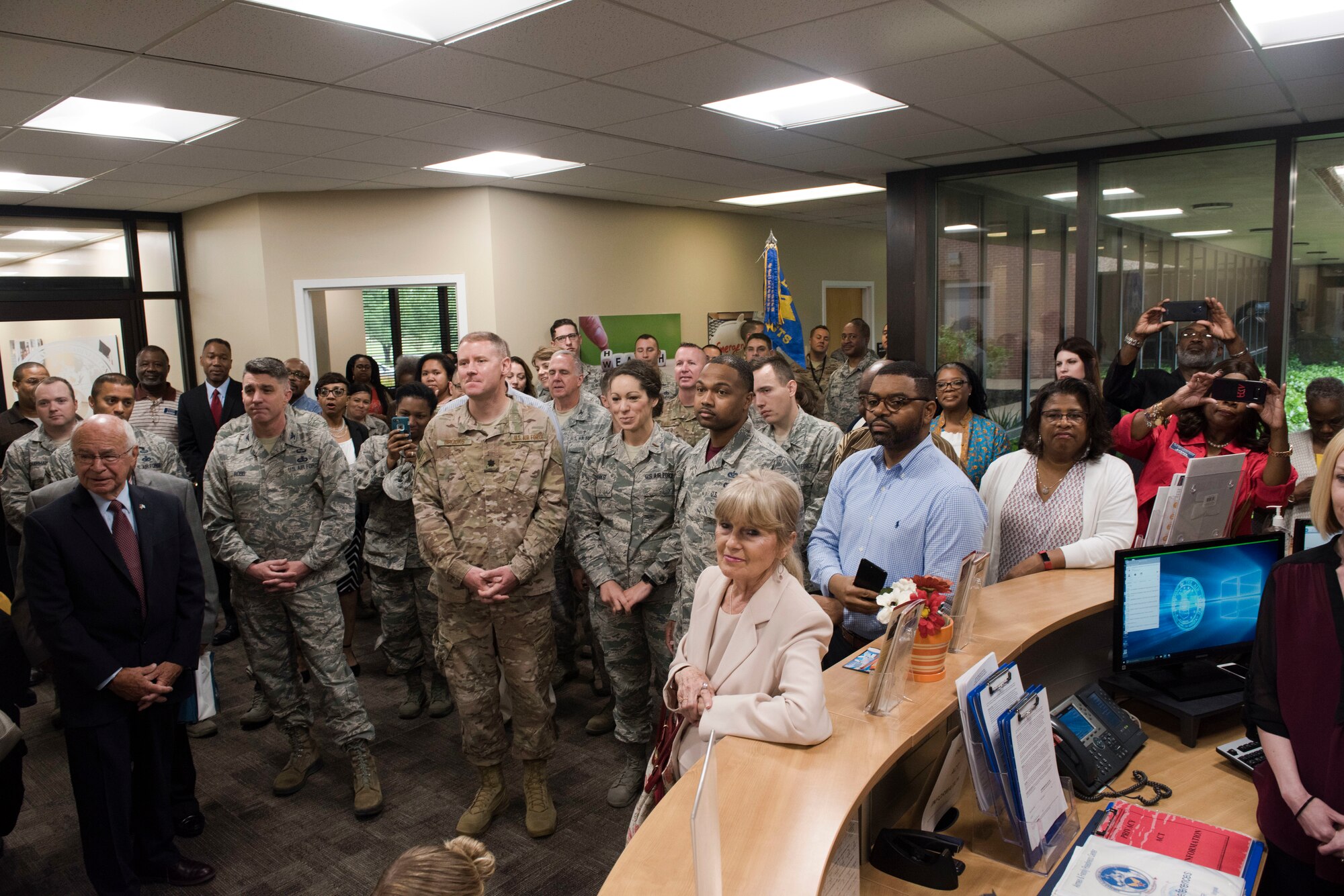 Guests of the Airman and Family Readiness Center reopening listen to a speech at Joint Base Langley-Eustis, Virginia, April 19, 2019.