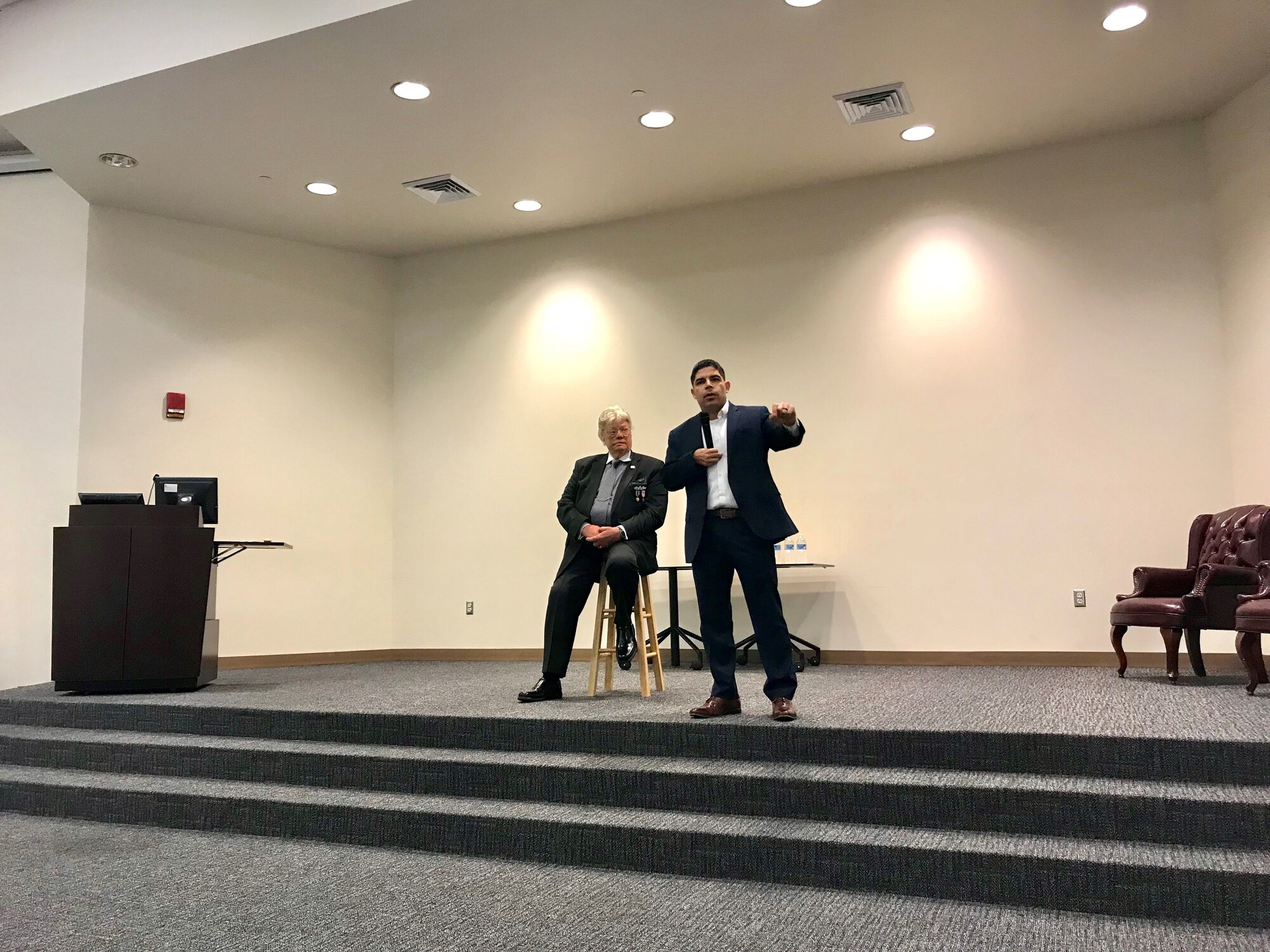 Dave Roever, U.S. Navy veteran and wounded warrior (seated) and U.S. Army Capt. (Ret.) John Arroyo, speak to Keesler Airmen about their personal experiences of recovery during a resiliency talk April 11, 2019 at Keesler Air Force Base, Miss. Both Roever and Arroyo shared how they continue to fight through their physical and emotional pain to teach others about resiliency. (U.S. Air Force photo by Sarah Loicano)