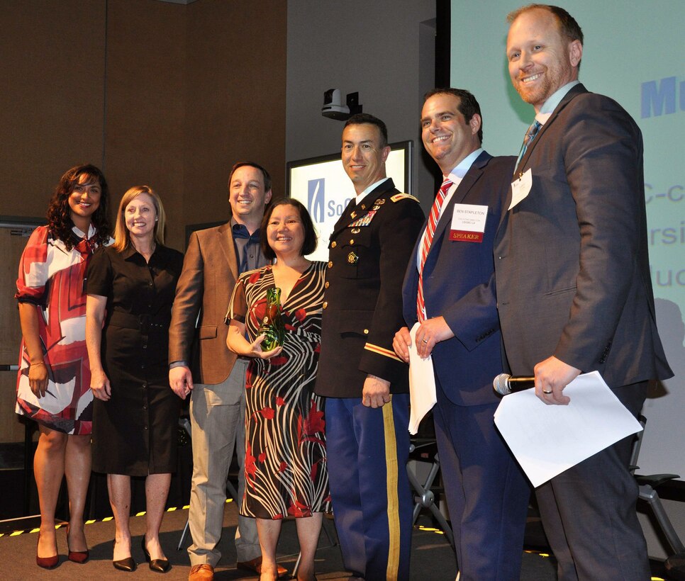 Col. Aaron Barta, U.S. Army Corps of Engineers Los Angeles District commander, and Patricia Kimura, project manager in the Programs and Project Management Division with the Corps’ LA District, accept an award for Municipal Project of the Year and LEED Platinum certification.