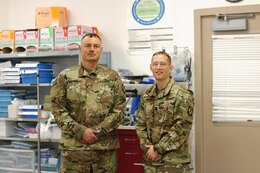 Cpt. Andrew Hehr and Maj. Anthony Delmonico, 452d Combat Support Hospital, serve as host nation liaisons with the United States Military Hospital - Kuwait, at Camp Arifjan.
