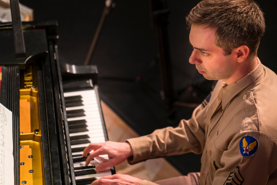 Technical Sgt. Chris Ziemba plays the piano at "On the Air: A Glenn Miller Swing Celebration," a show that featured The U.S. Air Force Band performing the music of big band legend Major Glenn Miller on April 2, 2019, at the Music Center at Strathmore in North Bethesda, Maryland. The U.S. Air Force Band partnered with Washington Performing Arts to present this concert highlighting the legacy of Major Miller's music and his leadership of the Army Air Force Band. This year marks the 75th anniversary of the disappearance of Miller's plane during World War II. (U.S. Air Force Photo by Master Sgt. Josh Kowalsky)