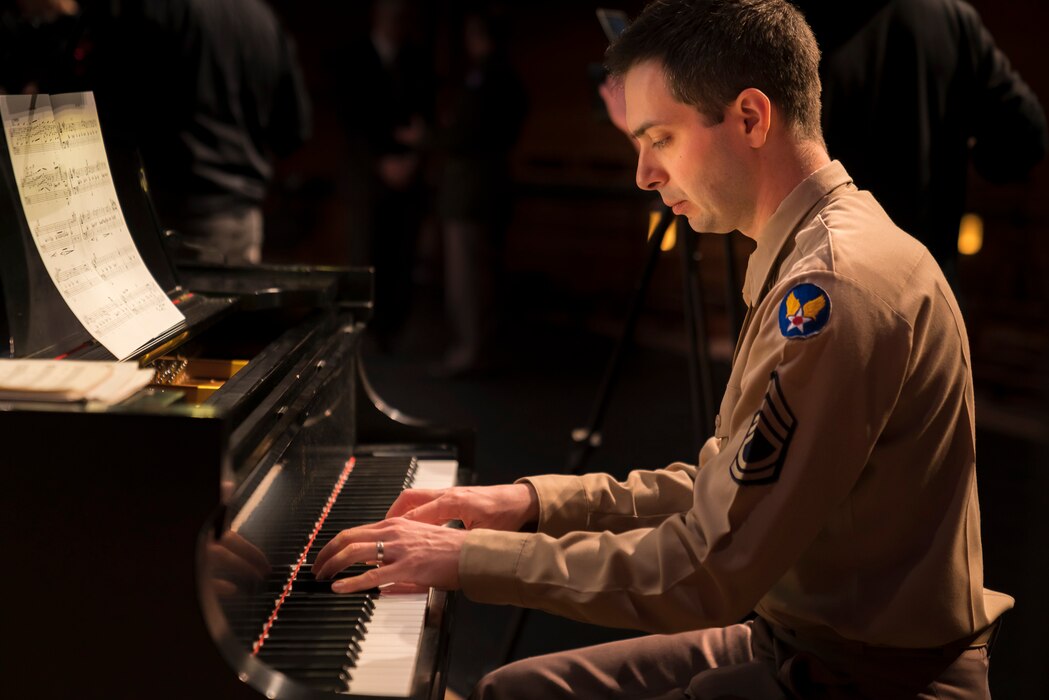 Technical Sgt. Chris Ziemba plays the piano at "On the Air: A Glenn Miller Swing Celebration," a show that featured The U.S. Air Force Band performing the music of big band legend Major Glenn Miller on April 2, 2019, at the Music Center at Strathmore in North Bethesda, Maryland. The U.S. Air Force Band partnered with Washington Performing Arts to present this concert highlighting the legacy of Major Miller's music and his leadership of the Army Air Force Band. This year marks the 75th anniversary of the disappearance of Miller's plane during World War II. (U.S. Air Force Photo by Master Sgt. Josh Kowalsky)