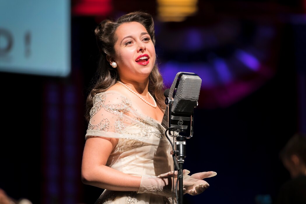 Acclaimed jazz vocalist Veronica Swift sings during "On the Air: A Glenn Miller Swing Celebration," a show featuring The U.S. Air Force Band performing the music of big band legend Major Glenn Miller on April 2, 2019, at the Music Center at Strathmore in North Bethesda, Maryland. The U.S. Air Force Band partnered with Washington Performing Arts to present this concert highlighting the legacy of Major Miller's music and his leadership of the Army Air Force Band. This year marks the 75th anniversary of the disappearance of Miller's plane during World War II. (U.S. Air Force Photo by Master Sgt. Josh Kowalsky)