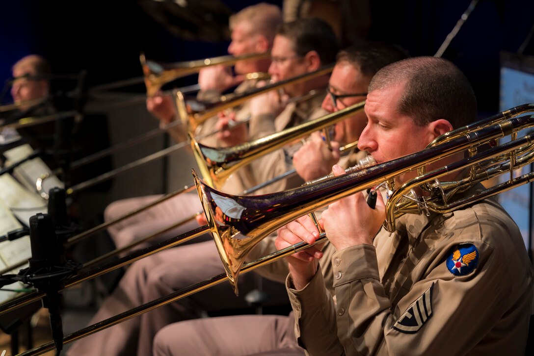 The trombone section performs during "On the Air: A Glenn Miller Swing Celebration," a show featuring The U.S. Air Force Band performing the music of big band legend Major Glenn Miller on April 2, 2019, at the Music Center at Strathmore in North Bethesda, Maryland. The U.S. Air Force Band partnered with Washington Performing Arts to present this concert highlighting the legacy of Major Miller's music and his leadership of the Army Air Force Band. This year marks the 75th anniversary of the disappearance of Miller's plane during World War II. (U.S. Air Force Photo by Master Sgt. Josh Kowalsky)