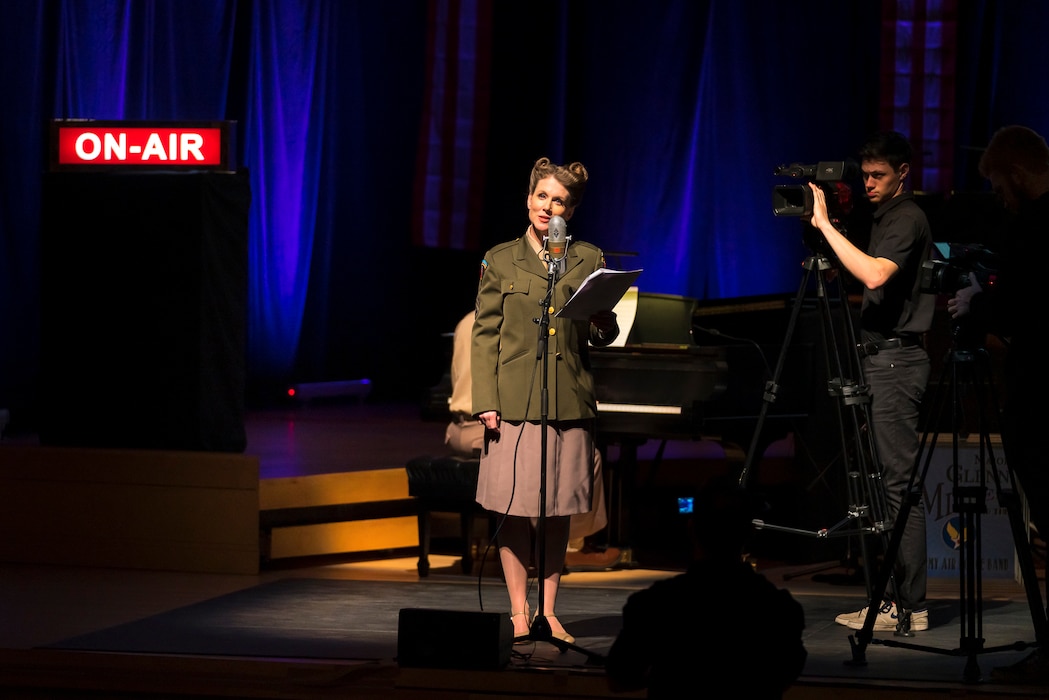 Master Sgt. Brooke Emory speaks to the audience at "On the Air: A Glenn Miller Swing Celebration," a show that featured The U.S. Air Force Band performing the music of big band legend Major Glenn Miller on April 2, 2019, at the Music Center at Strathmore in North Bethesda, Maryland. The U.S. Air Force Band partnered with Washington Performing Arts to present this concert highlighting the legacy of Major Miller's music and his leadership of the Army Air Force Band. This year marks the 75th anniversary of the disappearance of Miller's plane during World War II. (U.S. Air Force Photo by Master Sgt. Josh Kowalsky)