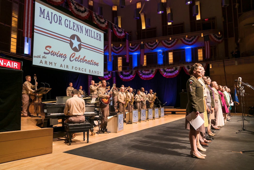 The entire cast comes onstage for the finale of "On the Air: A Glenn Miller Swing Celebration," a show that featured The U.S. Air Force Band performing the music of big band legend Major Glenn Miller on April 2, 2019, at the Music Center at Strathmore in North Bethesda, Maryland. The U.S. Air Force Band partnered with Washington Performing Arts to present this concert highlighting the legacy of Major Miller's music and his leadership of the Army Air Force Band. This year marks the 75th anniversary of the disappearance of Miller's plane during World War II. (U.S. Air Force Photo by Master Sgt. Josh Kowalsky)