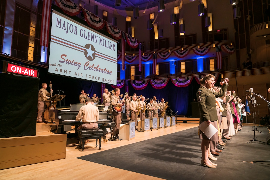 The entire cast comes onstage for the finale of "On the Air: A Glenn Miller Swing Celebration," a show that featured The U.S. Air Force Band performing the music of big band legend Major Glenn Miller on April 2, 2019, at the Music Center at Strathmore in North Bethesda, Maryland. The U.S. Air Force Band partnered with Washington Performing Arts to present this concert highlighting the legacy of Major Miller's music and his leadership of the Army Air Force Band. This year marks the 75th anniversary of the disappearance of Miller's plane during World War II. (U.S. Air Force Photo by Master Sgt. Josh Kowalsky)