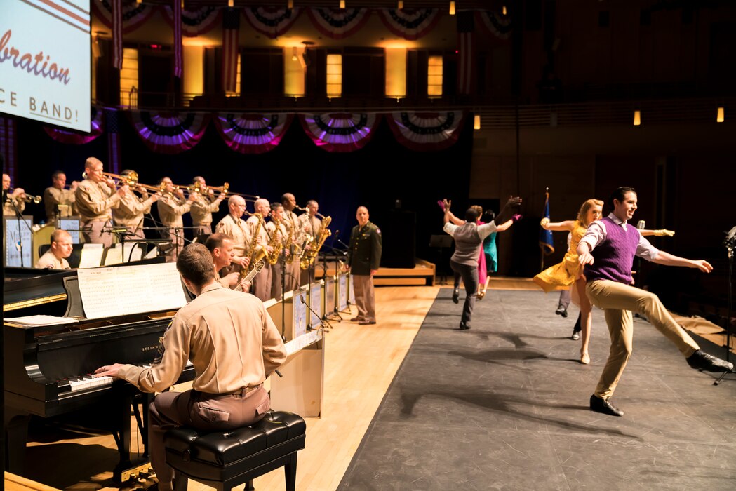 Members of The U.S. Air Force Band perform the music of big band legend Major Glenn Miller as dancers take center stage on April 2, 2019, at the Music Center at Strathmore in North Bethesda, Maryland. The U.S. Air Force Band partnered with Washington Performing Arts to present this concert highlighting the legacy of Major Miller's music and his leadership of the Army Air Force Band. This year marks the 75th anniversary of the disappearance of Miller's plane during World War II. (U.S. Air Force Photo by Master Sgt. Josh Kowalsky)