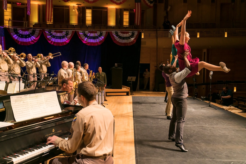 Members of The U.S. Air Force Band perform the music of big band legend Major Glenn Miller as dancers take center stage on April 2, 2019, at the Music Center at Strathmore in North Bethesda, Maryland. The U.S. Air Force Band partnered with Washington Performing Arts to present this concert highlighting the legacy of Major Miller's music and his leadership of the Army Air Force Band. This year marks the 75th anniversary of the disappearance of Miller's plane during World War II. (U.S. Air Force Photo by Master Sgt. Josh Kowalsky)