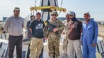 Staff Sgt. Bradley Owens, a combat medic with the West Virginia Army National Guard’s (WVARNG) Company C, 2-104th General Support Aviation Battalion, poses with Iraqi nationals during a tour of duty in Taji, Iraq, in 2016. Owens recently was able to apply his combat medic training to assist a driver whose vehicle had careened off an interstate overpass in Parkersburg, W.Va. (Courtesy photo)