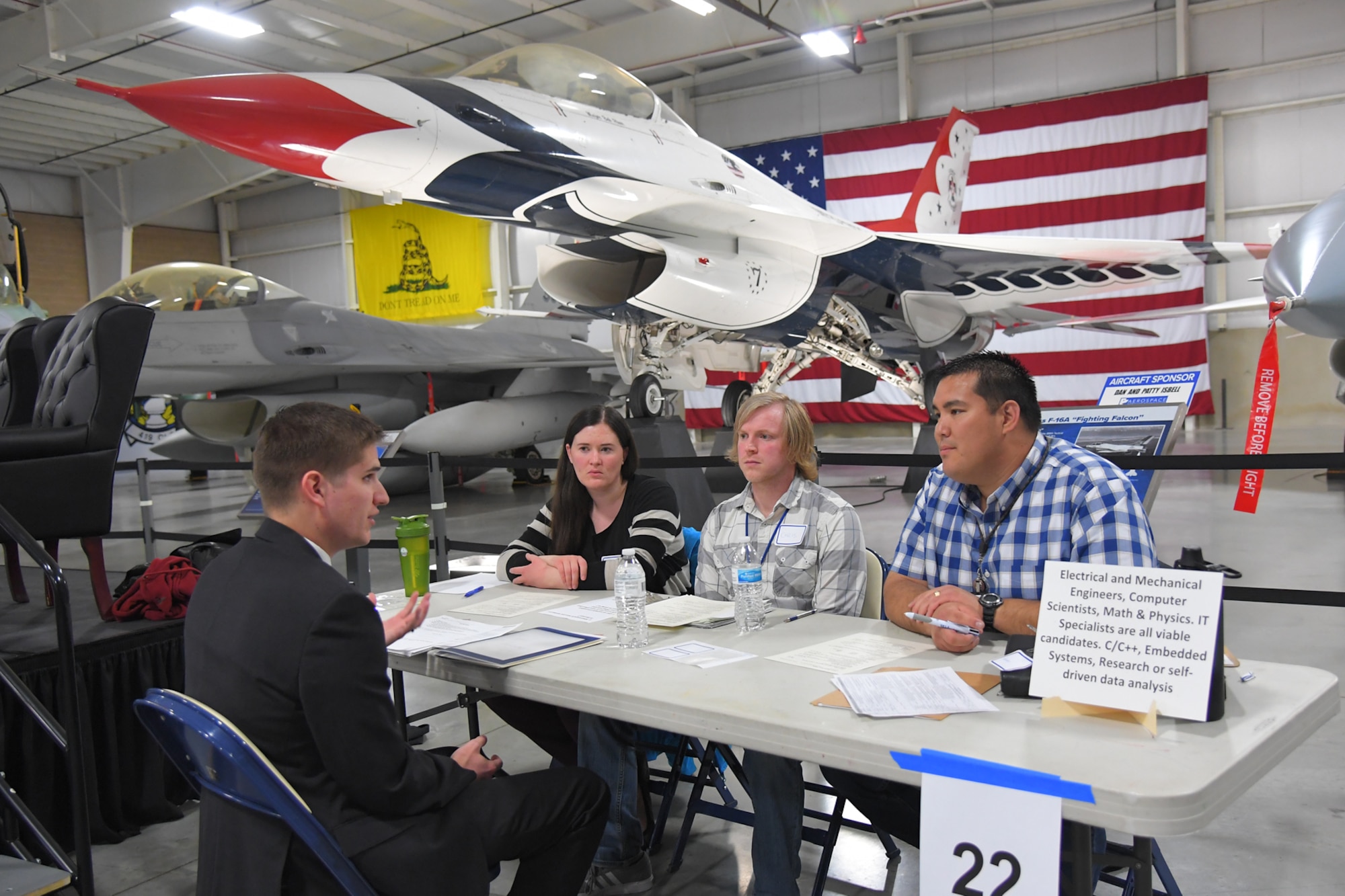 A potential hire is interviewed during a job fair March 20, 2019, at Hill Air Force Base, Utah. The event held at the base’s museum focused on hiring civilian scientists and engineers. Due to workload growth and attrition of a senior workforce, Hill AFB is expecting to hire 200-300 scientists and engineers per year for the next few years. (U.S Air Force photo by Todd Cromar)