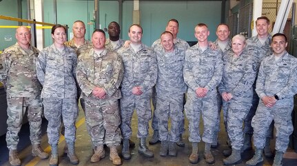 Thirteen of the 50 Air Transportation specialists from the 109th Airlift Wing at Stratton Air National Guard Base, Scotia, New York,  pose for a photograph at Muniz Air National Guard Base  in Puerto Rico on March 16, 2019, while supporting the 156th Air Transportation Operations Center at Muniz ANGB to help out with Vigilant Guard 2019. The 109th Air Transportation Operations Center was named best Air Transportation Activity in the Air Force for 2018.