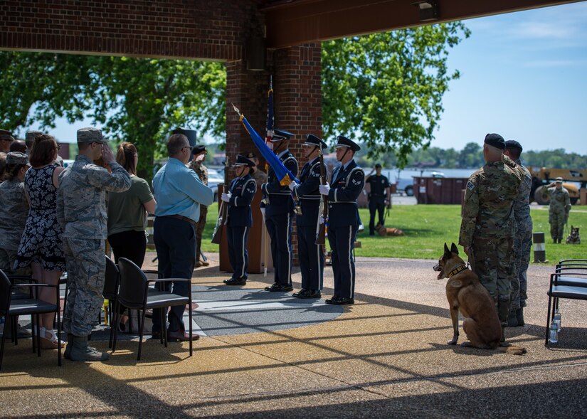 The Langley Air Force Base Honor Guard post the colors during a retirement ceremony in honor of U.S. Air Force Military Working Dog Max, 633rd Security Forces Squadron explosives detector at Joint Base Langley-Eustis, Virginia, April 23, 2019.