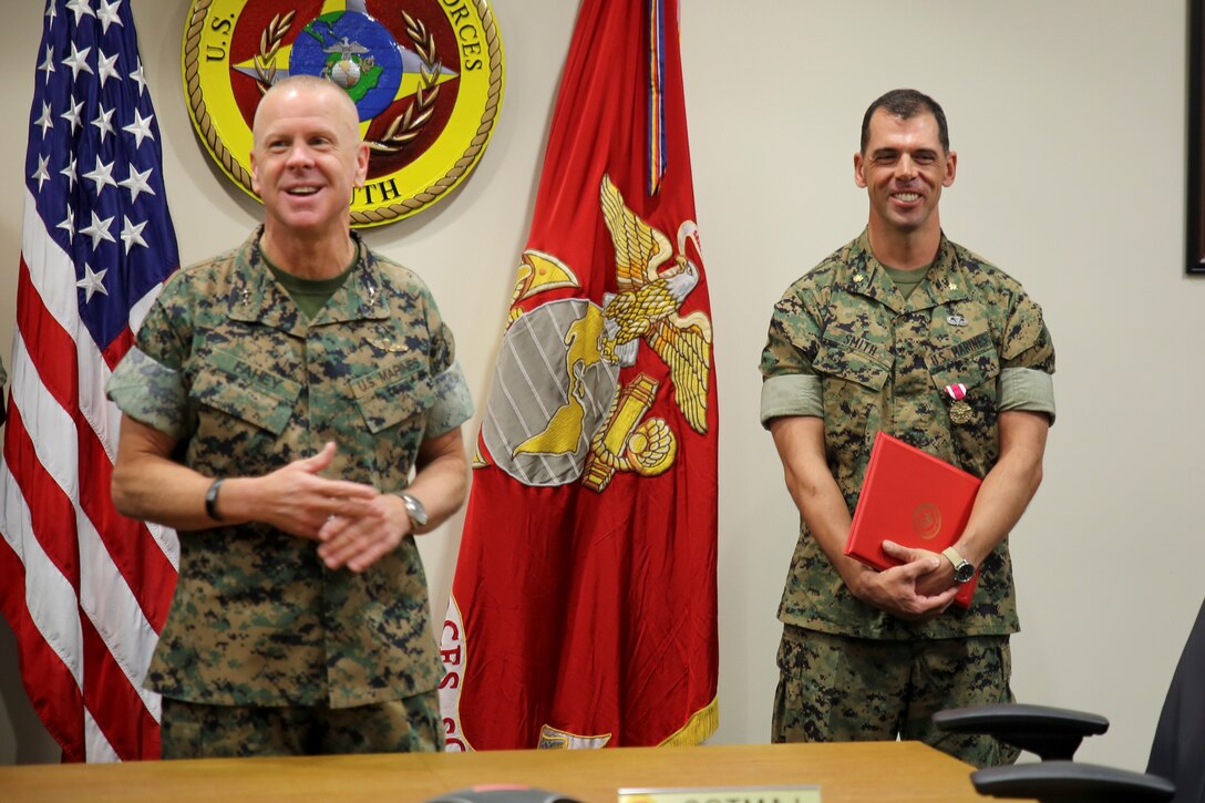 Maj. James R. Smith receives a Meritorious Service Medal for his dedication and selfless service at U.S. Marine Corps Forces, South, April 11, 2019.