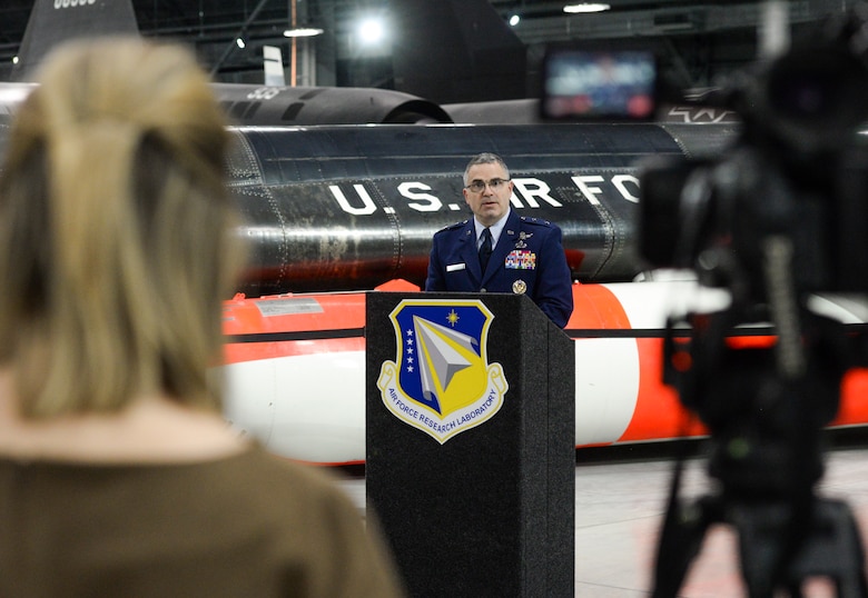 A member of the local media records U.S. Air Force Maj. Gen. William T. Cooley, Air Force Research Laboratory commander, as he delivers remarks during a press conference inside the National Museum of the United States Air Force, Wright-Patterson Air Force Base, Ohio, April 18, 2019. Cooley spoke on AFRL’s efforts to work with small businesses and universities in an effort to focus on speed when it comes to the science and technology strategy as unveiled by Secretary of the Air Force Heather Wilson. (U.S. Air Force photo by Wesley Farnsworth)