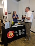 Denise Harris, Colorado National Guard Family Program coordinator, assists a retired service member at the 2018 Joining Communityu Forces Resource Expo in Denver. The purpose of the expo is to educate service members and their families about local free to low-cost community resources. It is open to service members from all military branches and components and as well as veterans, retirees, Wounded Warriors, and family members. (Stock photo)