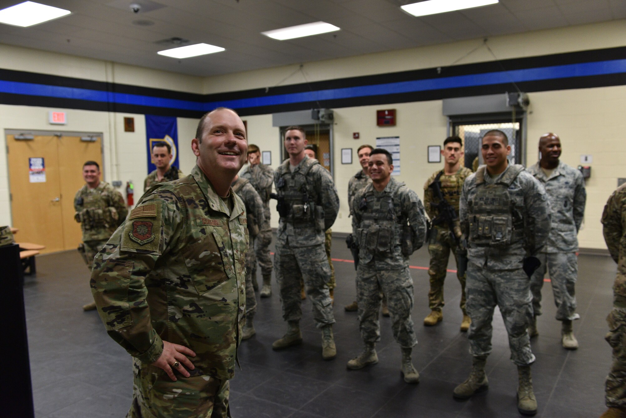 Brig Gen Doug Schiess, 45th Space Wing commander, and 45th Security Forces Airmen share a moment at Patrick Air Force Base, Fla., April 16, 2019. Schiess visited the 45th SFS to learn about new capabilities and to be immersed in the Security Forces mission. (U.S. Air Force photo by Airman 1st Class Dalton Williams)