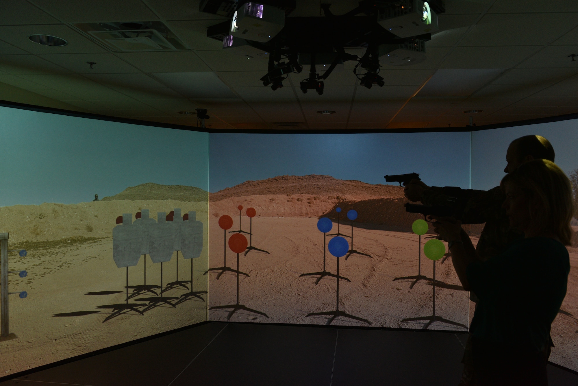 Brig Gen Doug Schiess, 45th Space Wing commander, and his wife, Debbie, partcipate in a Virtual Combat Arms Training and Maintenance exercise at Patrick Air Force Base, Fla., April 16, 2019. Schiess visited the 45th Security Forces Squadron to learn about new capabilites, and to be immersed in the 45th SFS mission. (U.S. Air Force photo by Airman 1st Class Dalton Williams)