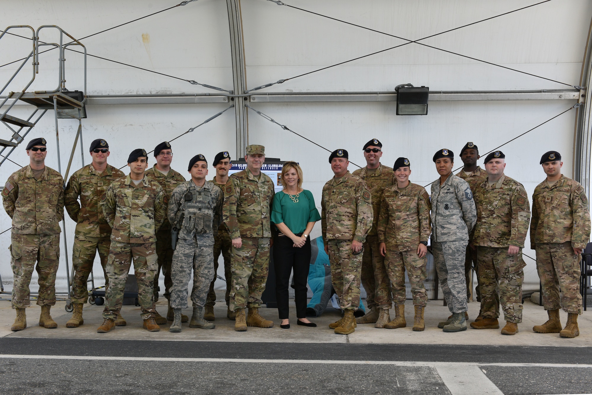 Brig Gen Doug Schiess, 45th Space Wing commander, his wife, Debbie, and 45th Security Forces Squadron Airmen pose for a photo at Patrick Air Force Base, Fla., April 16, 2019. Schiess visited the 45th SFS to learn about new capabilities and to be immersed in the Security Forces mission. (U.S. Air Force photo by Airman 1st Class Dalton Williams)