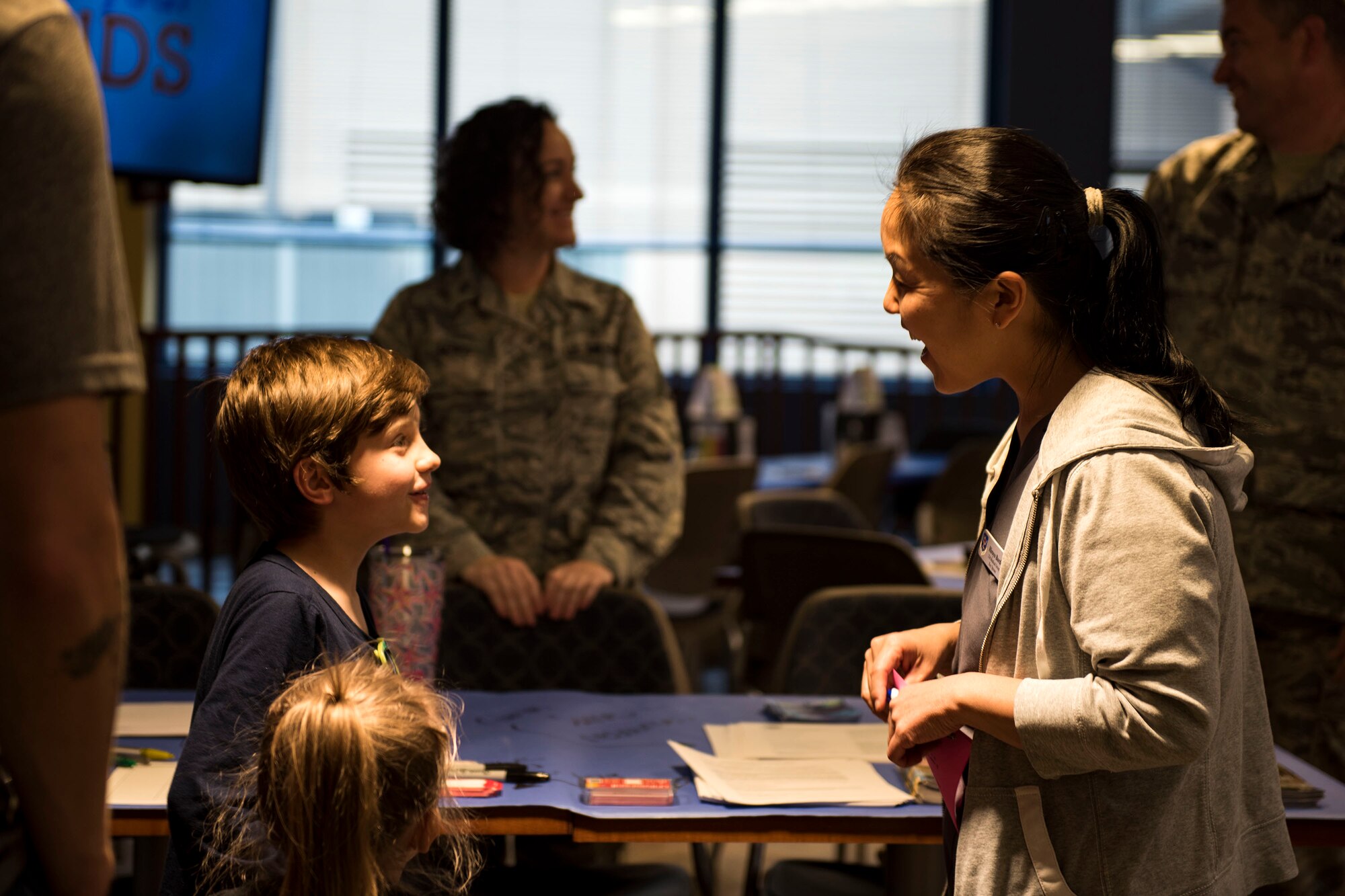 A key spouse talks to a participant during a deployed spouse dinner, April 23, 2019, at Moody Air Force Base, Ga. The dinner served as an opportunity for the families of deployed members to bond and provide relief. The mission’s success depends on resilient Airmen and families, who are prepared to make sacrifices with the support of their fellow Airmen, local communities and leadership. (U.S. Air Force photo by Senior Airman Erick Requadt)