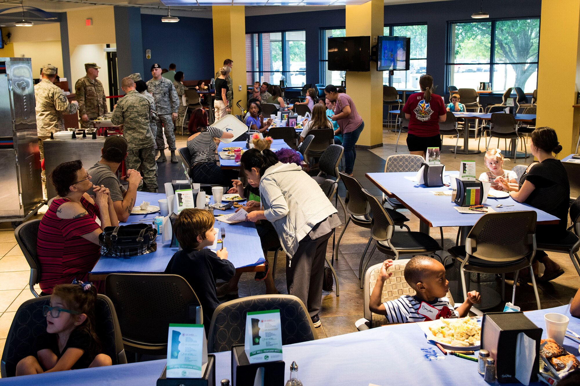 Participants eat and socialize during a deployed spouse dinner, April 23, 2019, at Moody Air Force Base, Ga. The dinner served as an opportunity for the families of deployed members to bond and provide relief. The mission’s success depends on resilient Airmen and families, who are prepared to make sacrifices with the support of their fellow Airmen, local communities and leadership. (U.S. Air Force photo by Senior Airman Erick Requadt)