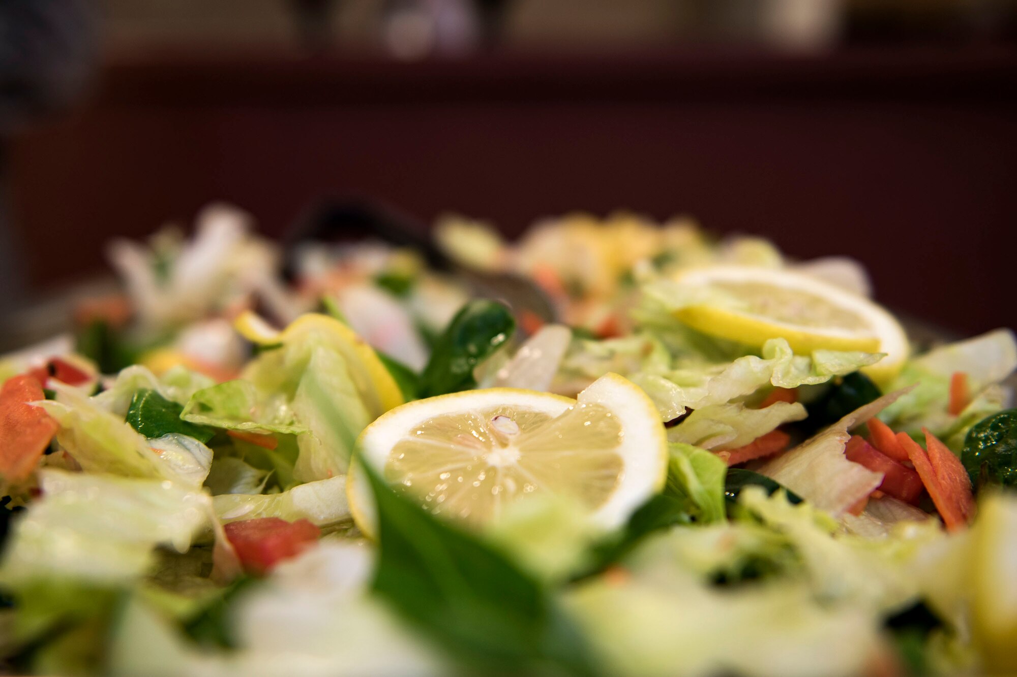 A tray of salad rests on a table during a deployed spouse dinner, April 23, 2019, at Moody Air Force Base, Ga. The dinner served as an opportunity for the families of deployed members to bond and provide relief. The mission’s success depends on resilient Airmen and families, who are prepared to make sacrifices with the support of their fellow Airmen, local communities and leadership. (U.S. Air Force photo by Senior Airman Erick Requadt)