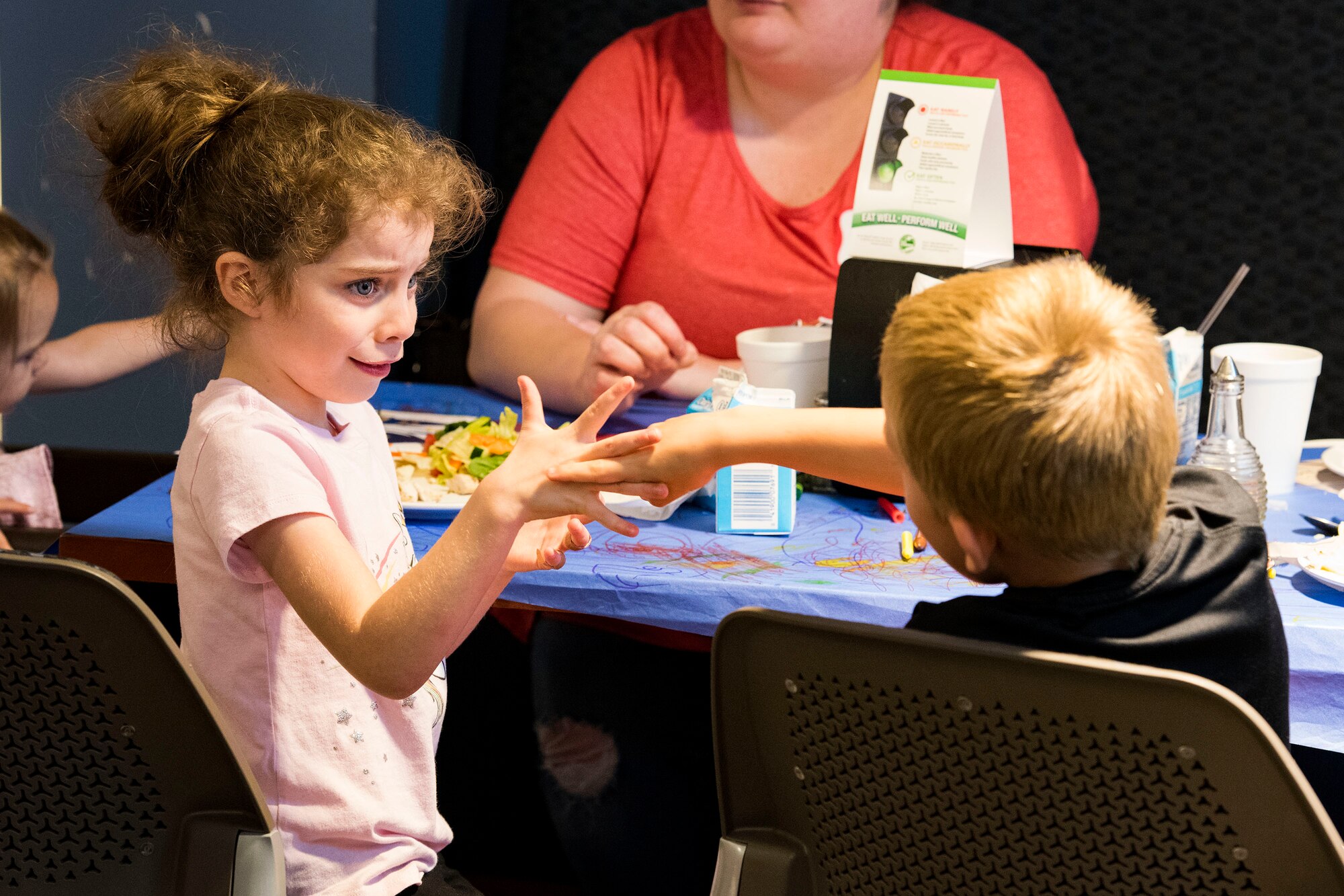 Participants play together during a deployed spouse dinner, April 23, 2019, at Moody Air Force Base, Ga. The dinner served as an opportunity for the families of deployed members to bond and provide relief. The mission’s success depends on resilient Airmen and families, who are prepared to make sacrifices with the support of their fellow Airmen, local communities and leadership. (U.S. Air Force photo by Senior Airman Erick Requadt)