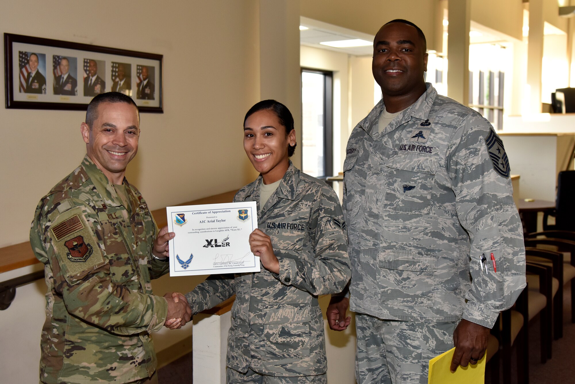 Airman 1st Class Arial Taylor, a 47th Comptroller Squadron commander support staff administration journeyman, was chosen by wing leadership to be the “XLer” of the week, for the week of April 17, 2019, at Laughlin Air Force Base, Texas. The “XLer” award, presented by Col. Lee Gentile, 47th Flying Training Wing commander, is given to those who consistently make outstanding contributions to their unit and the Laughlin mission. (U.S. Air Force photo by Senior Airman John A. Crawford)