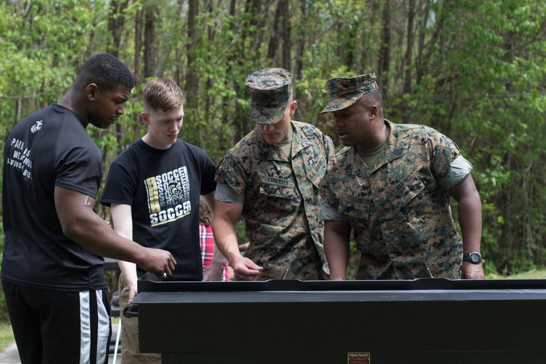 U.S. Marines with Combat Logistics Regiment 27, 2nd Marine Logistics Group, look at a new grill during a barracks bash on Camp Lejeune, North Carolina, April 18, 2019. The purpose of the barracks bash was to celebrate completed barracks renovations, strengthen cohesion, foster a positive atmosphere and enhance the quality of life for Marines and Sailors. (U.S. Marine Corps photo by Cpl. Damion Hatch Jr)