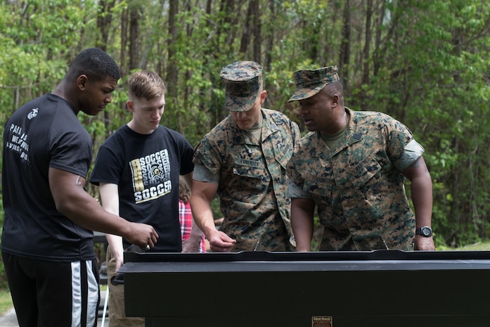 U.S. Marines with Combat Logistics Regiment 27, 2nd Marine Logistics Group, play volleyball during a barracks bash on Camp Lejeune, North Carolina, April 18, 2019. The purpose of the barracks bash was to celebrate completed barracks renovations, strengthen cohesion, foster a positive atmosphere and enhance the quality of life for Marines and Sailors. (U.S. Marine Corps photo by Cpl. Damion Hatch Jr)